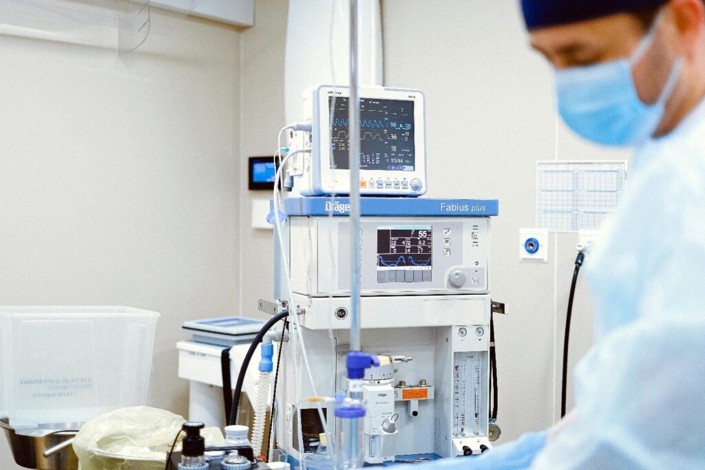 A Medical Professional Wearing Wearing a Facemask While Standing Near the Operating Room 